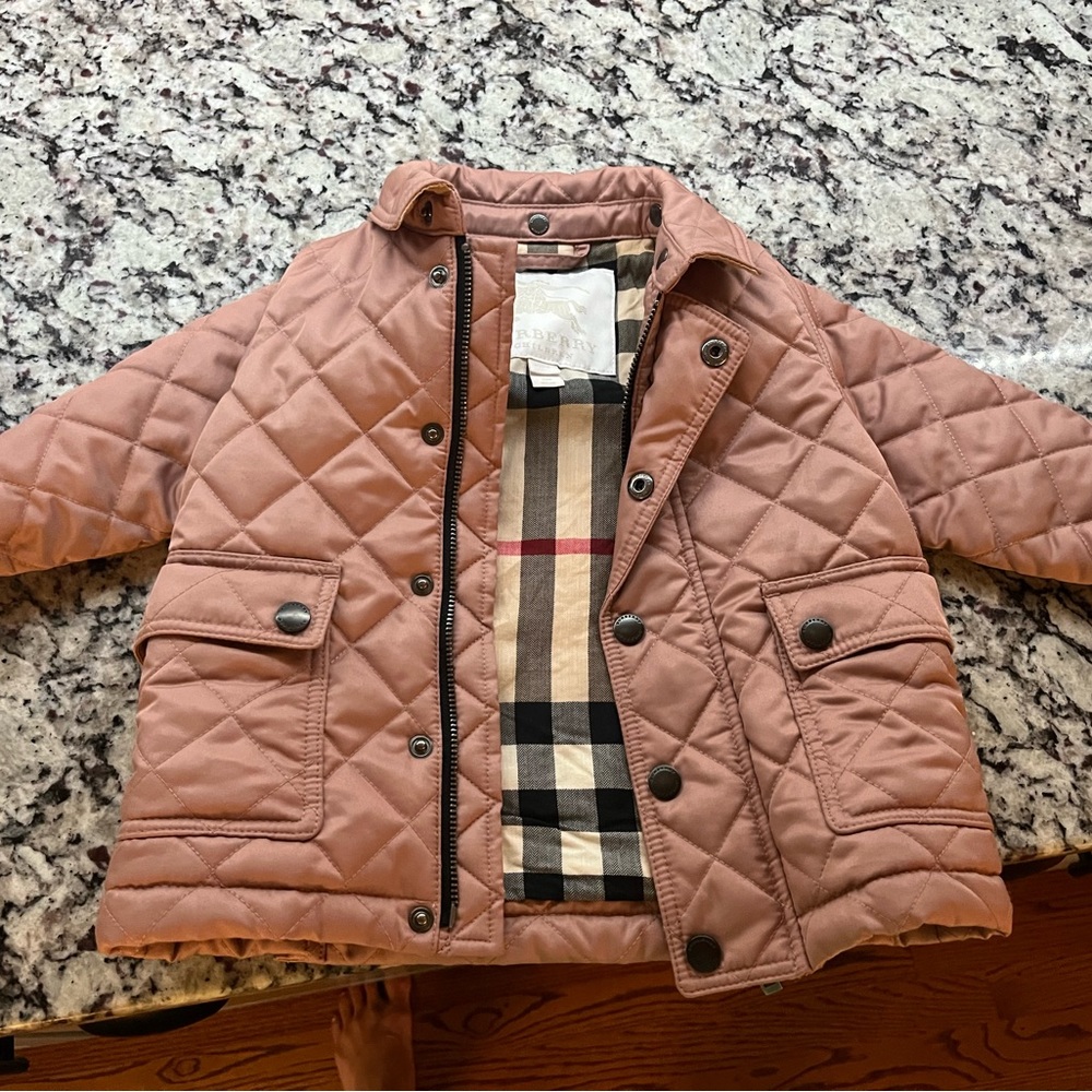 Burberry jacket with hood in amazing condition… 12 months .